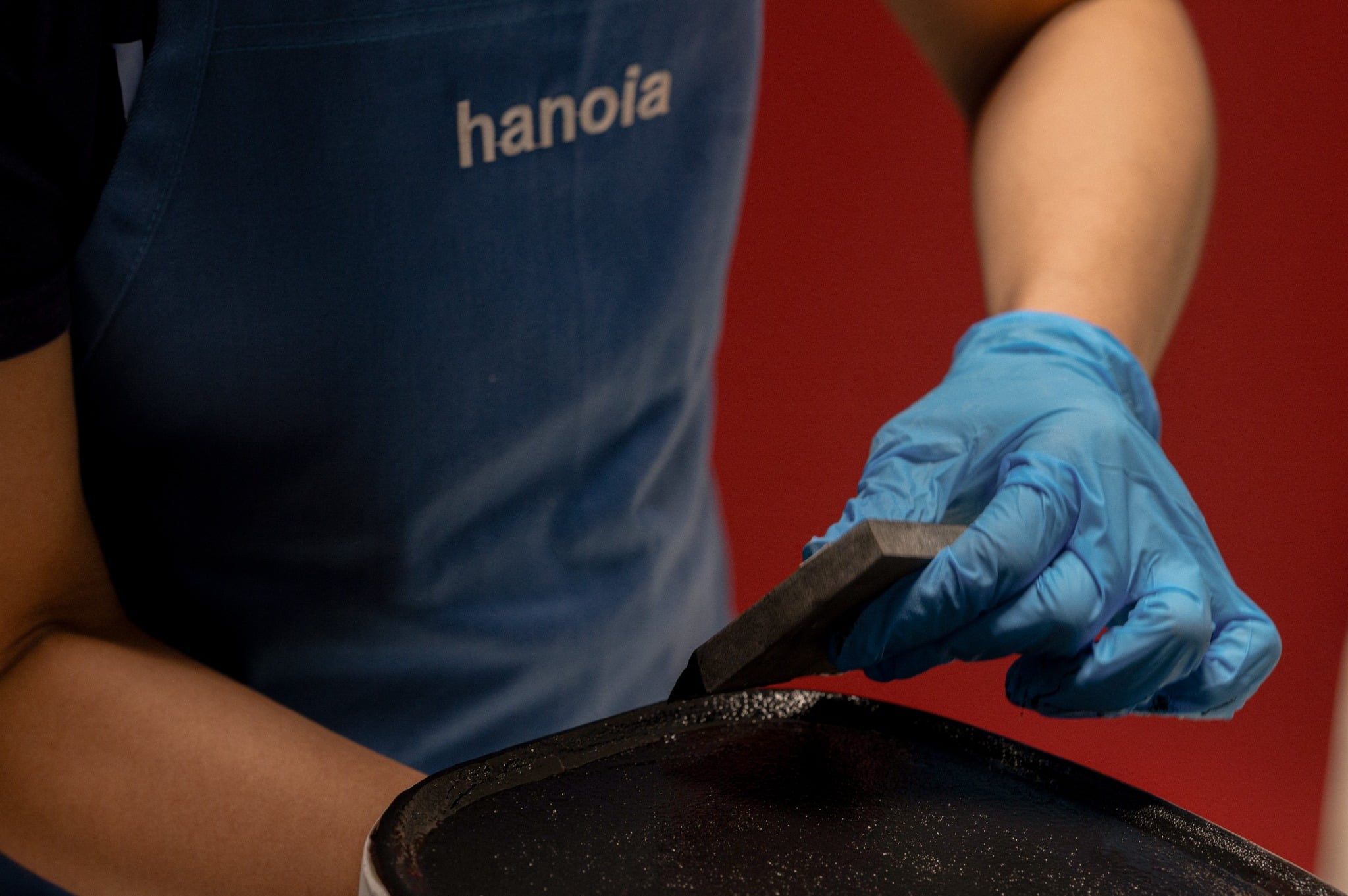 Artisan working in the lacquer tradition of Ha Thai village